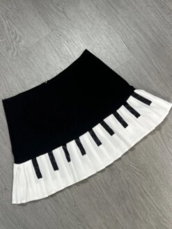 Alternative view of Pleated mini-skirt with a piano key pattern.