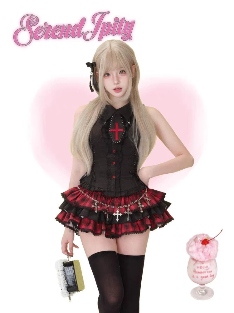 A sleeveless, black dress with a lapel collar and lace details.