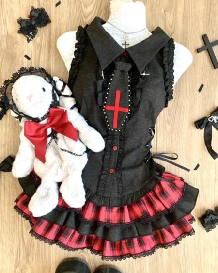 Alternative view of black dress with a lapel collar and lace details.