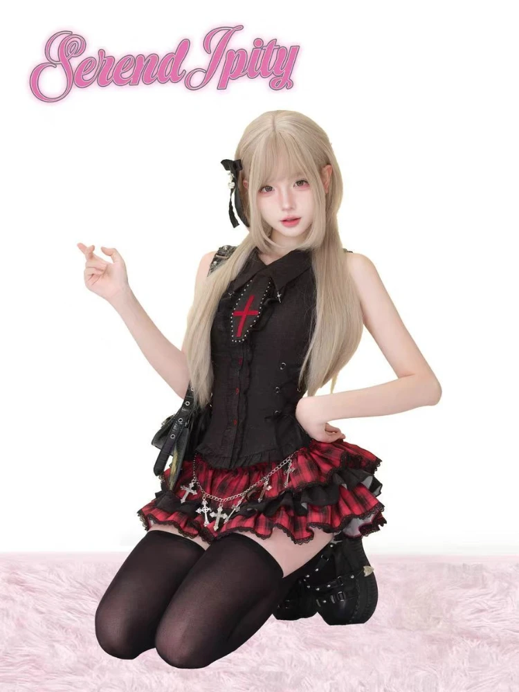 A sleeveless, black dress with a lapel collar and lace details.