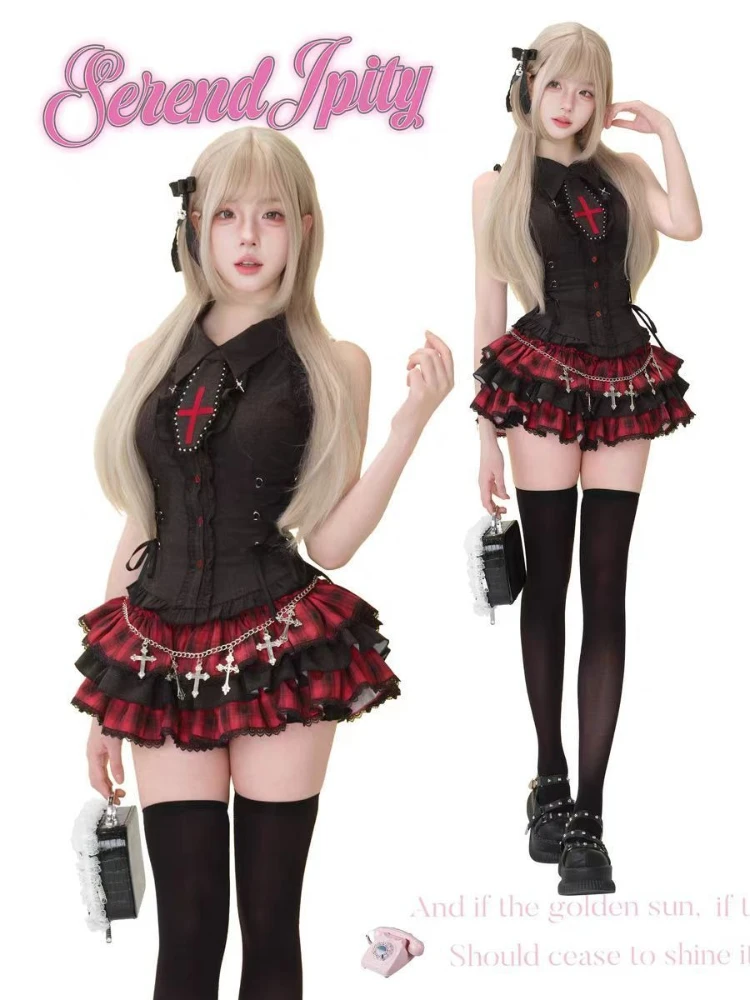 A sleeveless, black dress with a lapel collar and lace details.