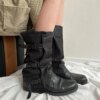 Shop black cowboy boots for women with a vintage Western design, buckle detail, round toe and side zipper. A stylish choice for Y2K, grunge and casual outfits.